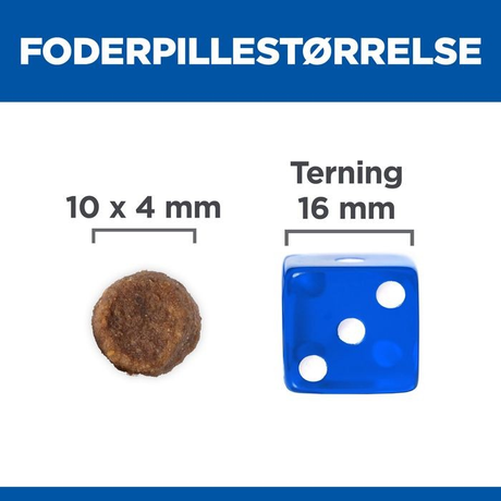 Et billede af Hill's Science Plan hvalpefoder - Tørfoder til mellemstore hvalpe på op til 1 år med lam og en lineal ved siden af, der viser den unikke kombination af disse to objekter.